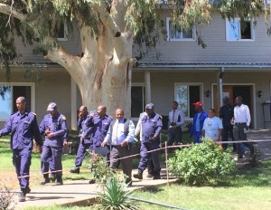 Senior police officers taking computer classes with Help Lesotho