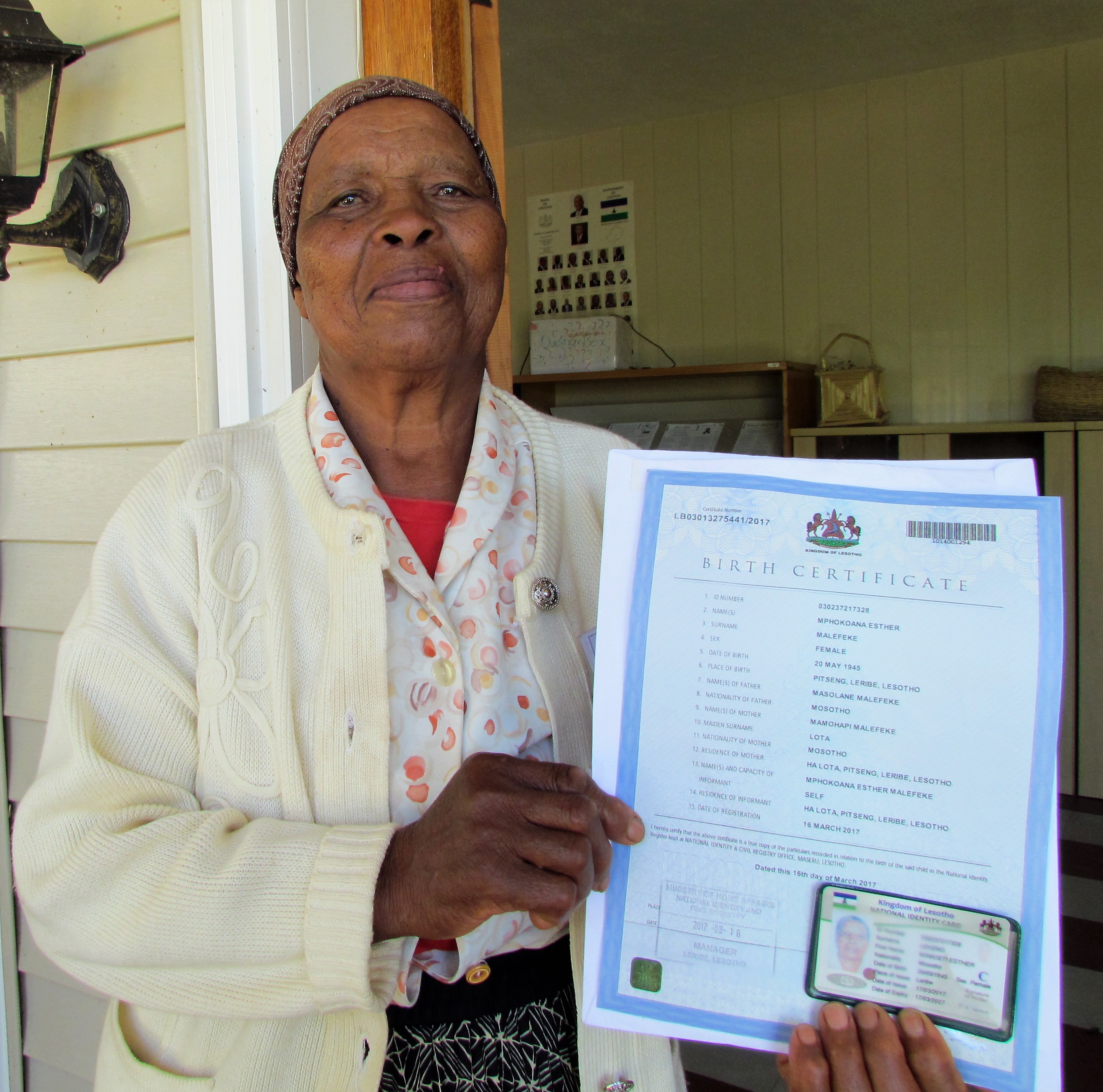 A proud grandmother with her identification pieces.