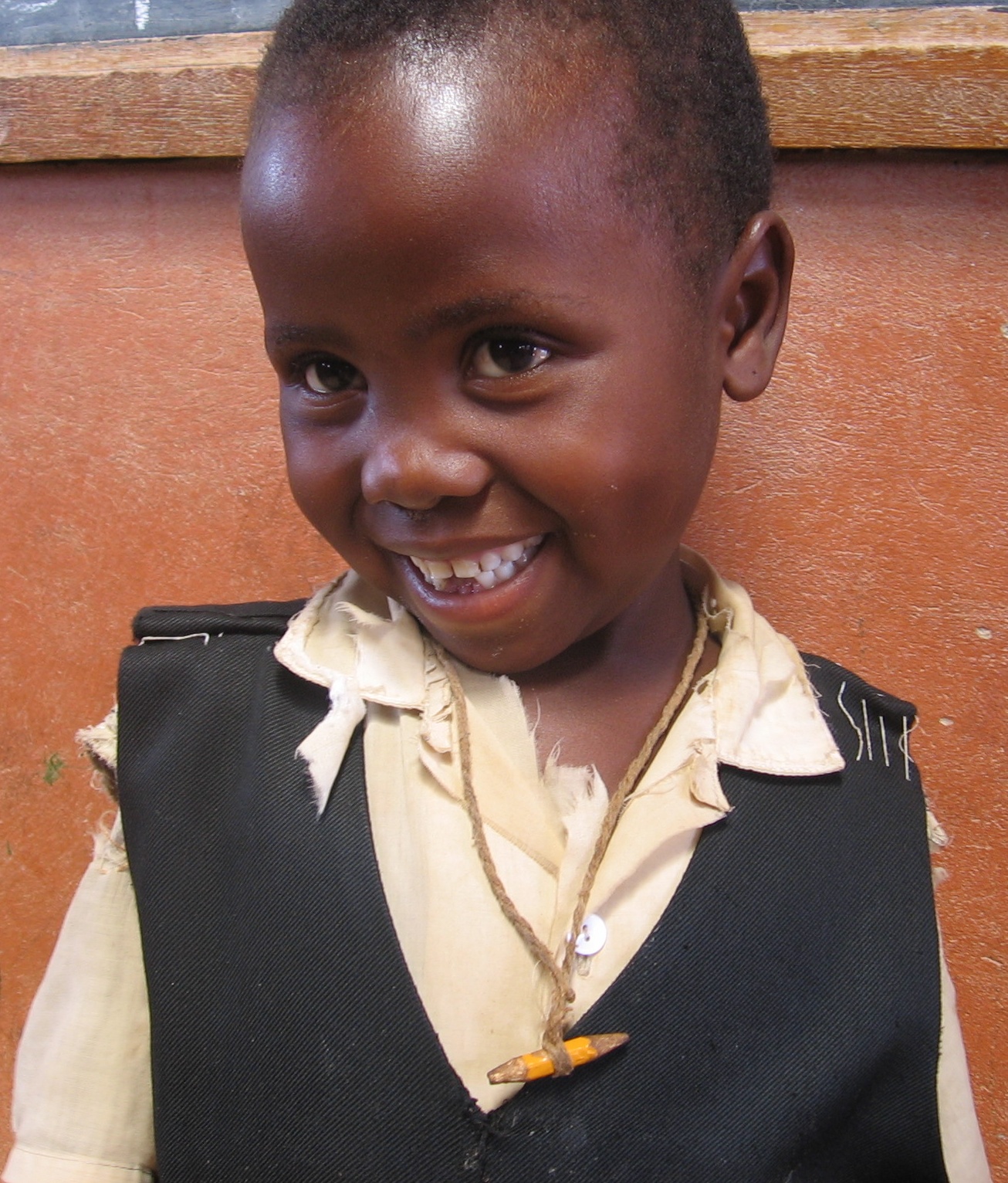 Lits’oanelo with a pencil stub tied around her neck for safe-keeping