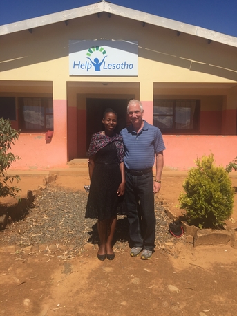 Ottawa visitor Ken poses outside of the Pitseng Centre with a Help Lesotho beneficiary.