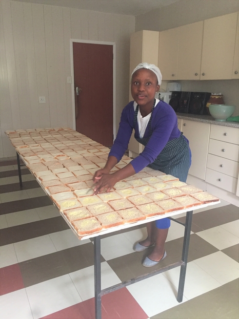 A Help Lesotho staff member prepared lunches for the Child Sponsorship guardians.