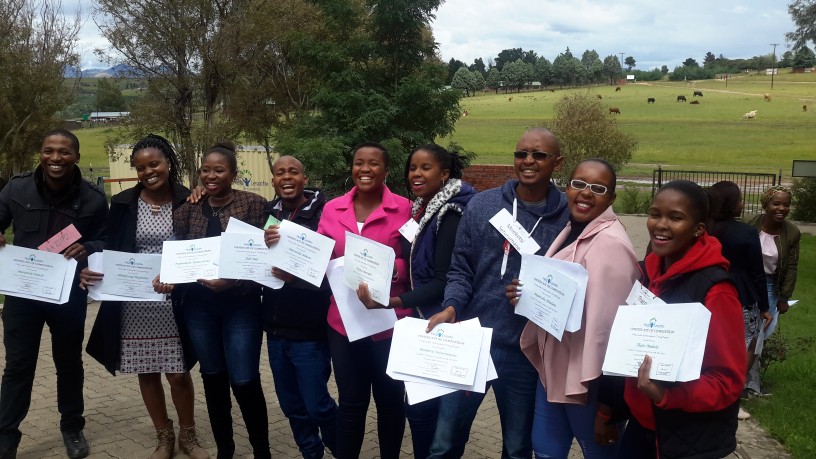 Graduates from 2018 Leadership programs pose together for a photo outside of the Hlotse Centre.