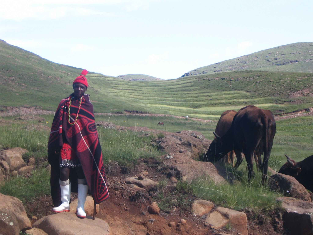 Herd boy in Lesotho wearing gum boots
