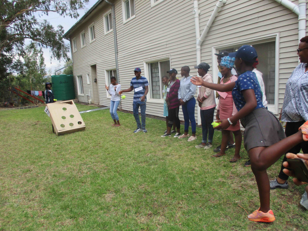 The campers get to let loose and play group games like beanbag toss.