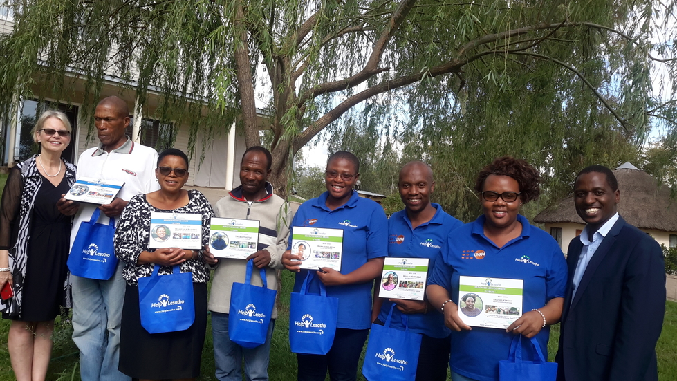 Help Lesotho staff recieve plaques to honour their committment to the team and their years of hard work.